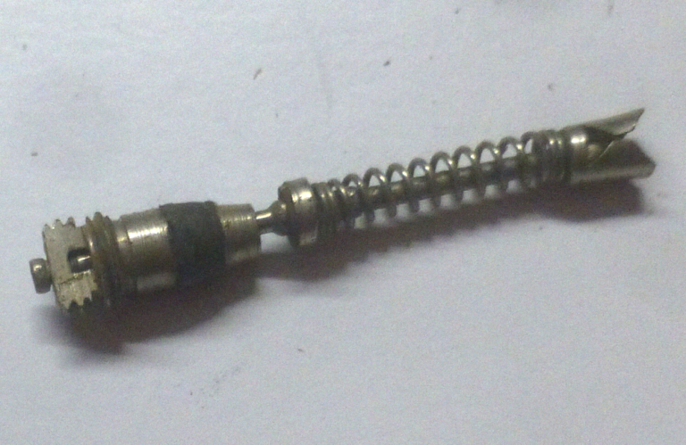Close-up of a spring-loaded Schrader valve core.