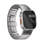 KW4024 Natural link watch band with butterfly clasp, angled front view on a display watch